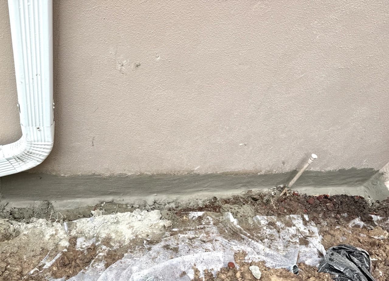 Fresh waterproofing seal along the base of a Florida exterior foundation wall Fresh waterproofing seal along the base of a Florida exterior foundation wall
