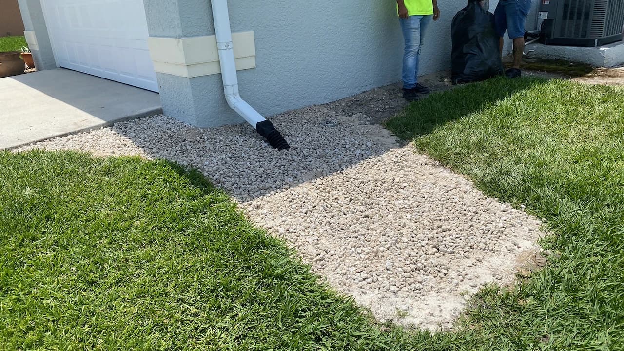 Completed gravel drainage apron installed beside a Florida block foundation Completed gravel drainage apron installed beside a Florida block foundation