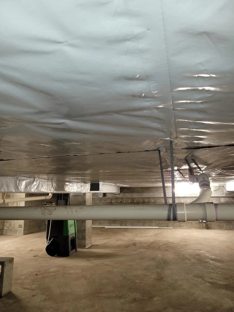 Completed moisture barrier installation in a low Florida crawl space Completed moisture barrier installation in a low Florida crawl space