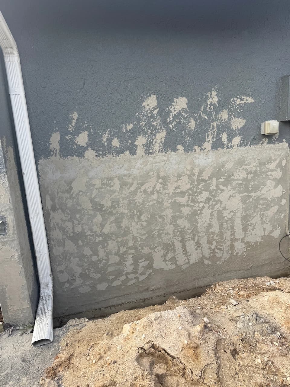 Exterior block wall showing moisture wear identified during a Florida mold inspection Exterior block wall showing moisture wear identified during a Florida mold inspection