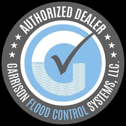 Garrison Flood Control Systems Authorized Dealer badge in grey and blue Garrison Flood Control Systems Authorized Dealer badge in grey and blue
